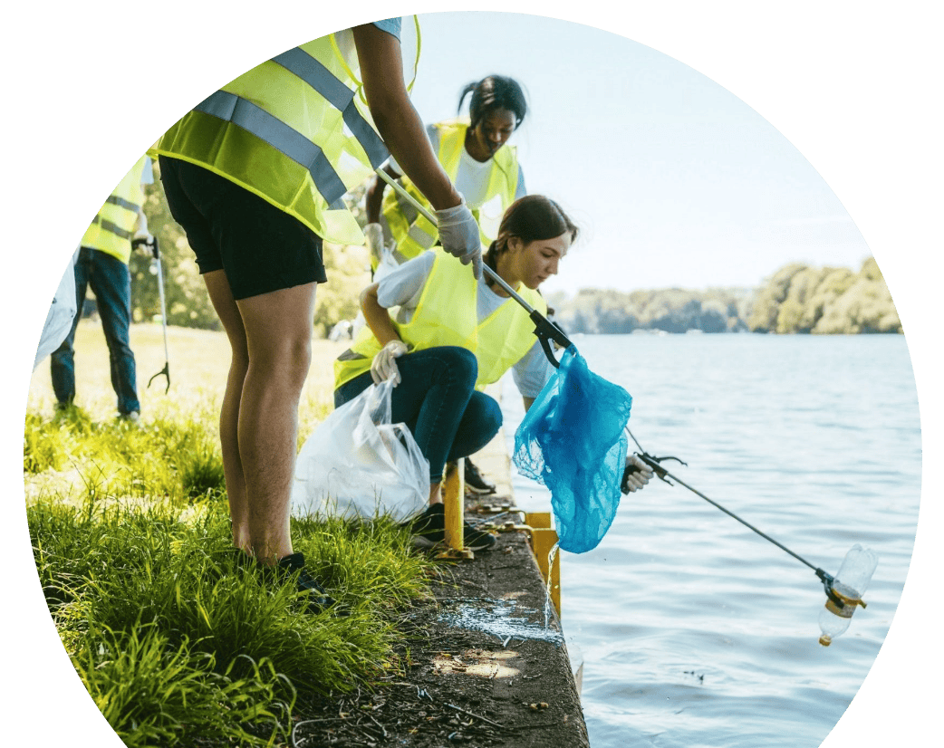Alpine Heating & Air Conditioning employees volunteering at a river clean-up event in Eugene, Oregon.