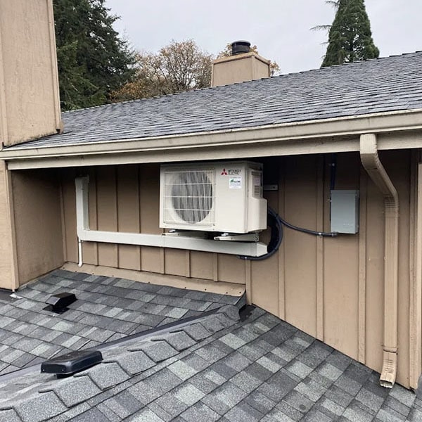 Air conditioning unit installed outside the second story of a two story home.