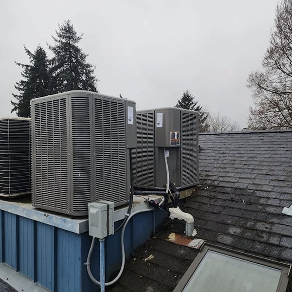 A commercial HVAC system installed on a wet roof.