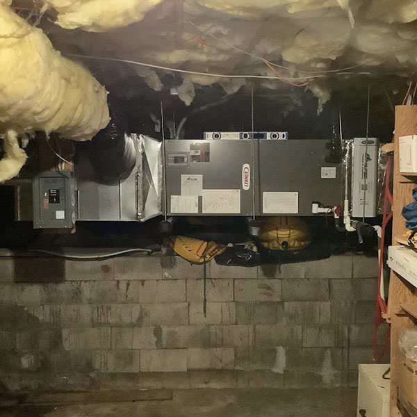  Insulation above a HVAC ductwork in a buildings basement.