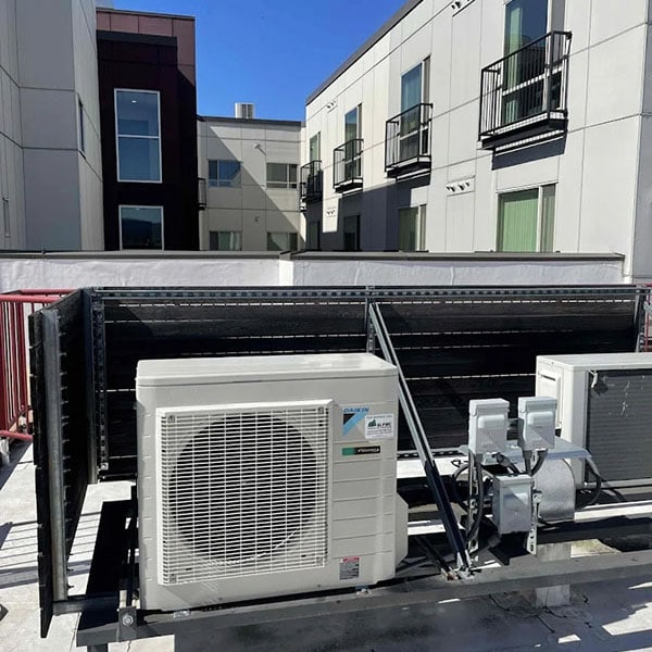 HVAC system installed on the roof of an apartment complex.