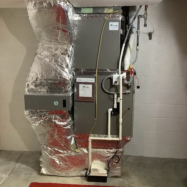 A newly installed gas furnace in a homes basement.