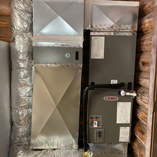 Gas furnace system in a homes basement.