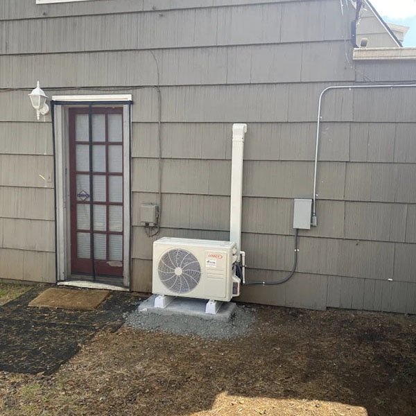 A Lennox heat pump installed outside a home.