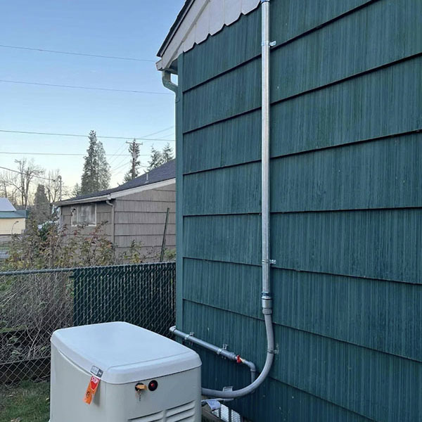 A newly installed Generac generator outside a home.