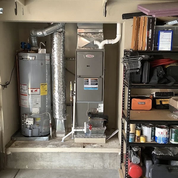 Tank water heater and HVAC system installed in a home.