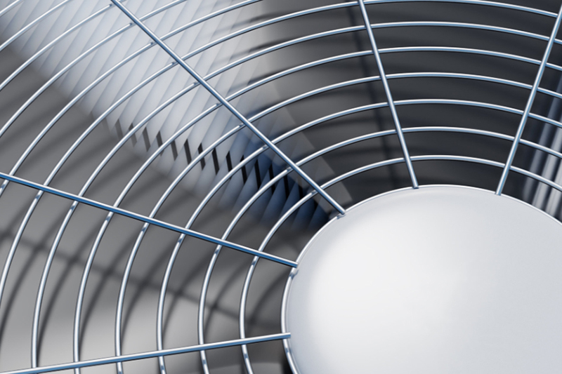Up close shot of air conditioning blades spinning.